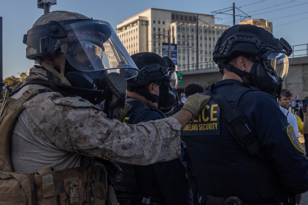 U.S. Marines guard federal building to assist California Army National Guard