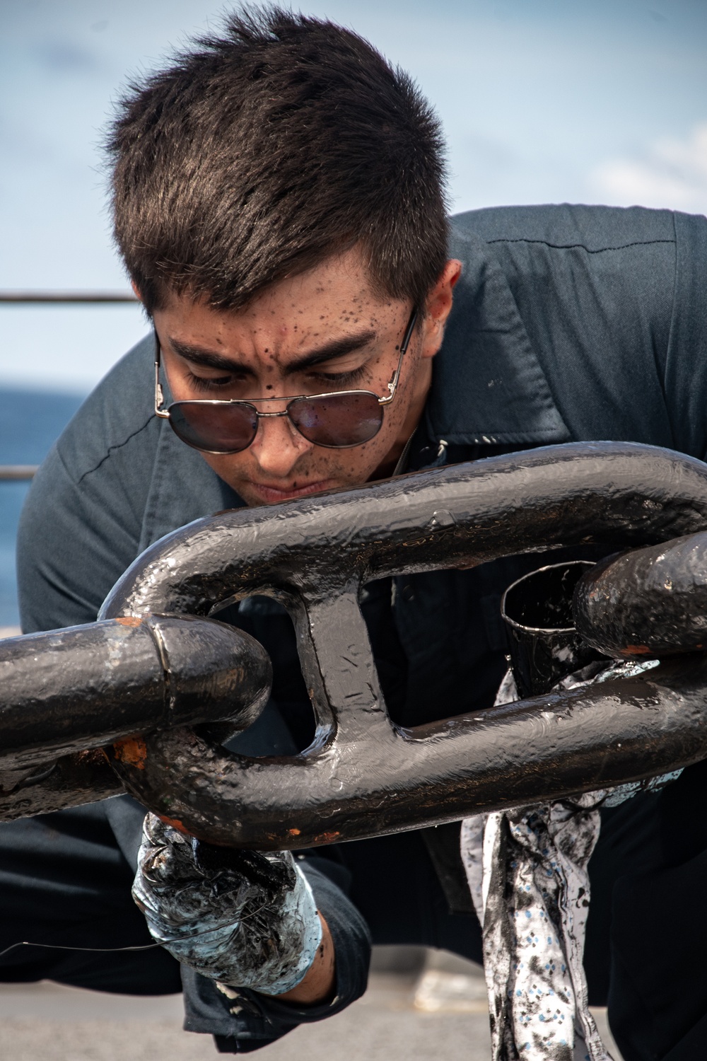 Sailor Paints Anchor Chain