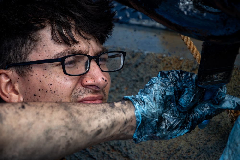 Sailor Paints Anchor Chain