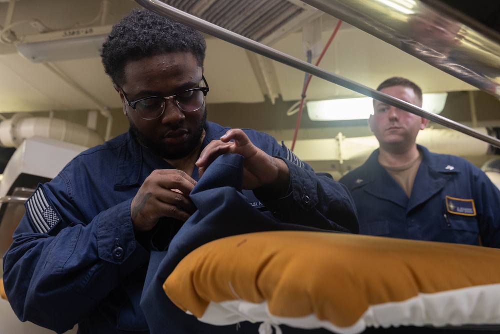 USS Gerald R. Ford (CVN 78) Sailors Work in Ship's Laundry