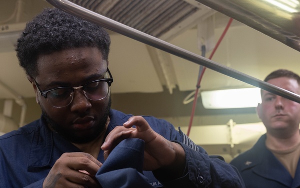 USS Gerald R. Ford (CVN 78) Sailors Work in Ship's Laundry