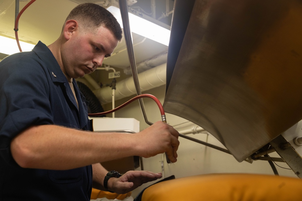 USS Gerald R. Ford (CVN 78) Sailors Work in Ship's Laundry