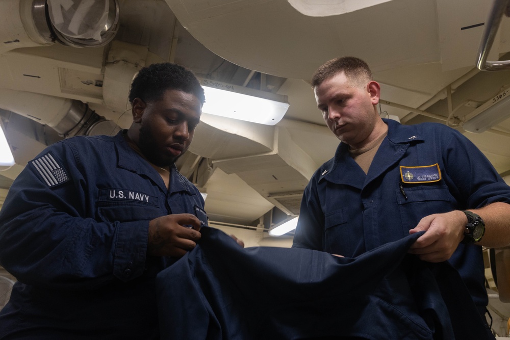 USS Gerald R. Ford (CVN 78) Sailors Work in Ship's Laundry