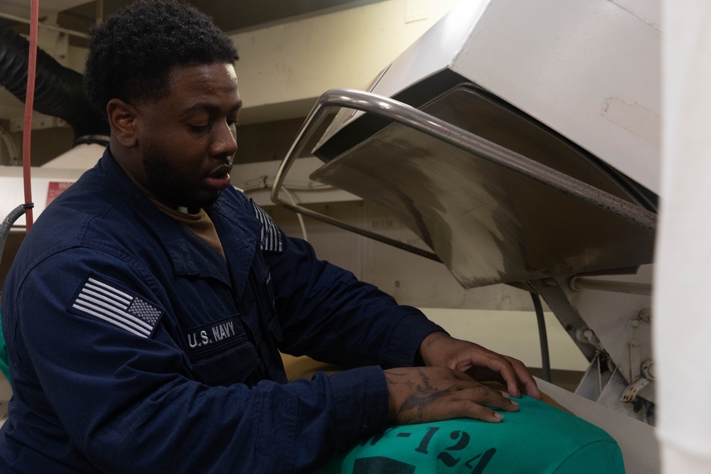 USS Gerald R. Ford (CVN 78) Sailors Work in Ship's Laundry