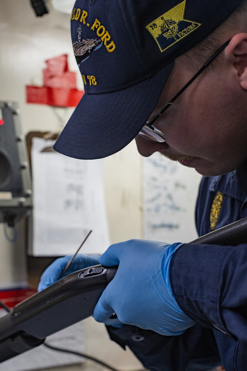 USS Gerald R. Ford (CVN 78) Sailor Performs Armory Maintenance