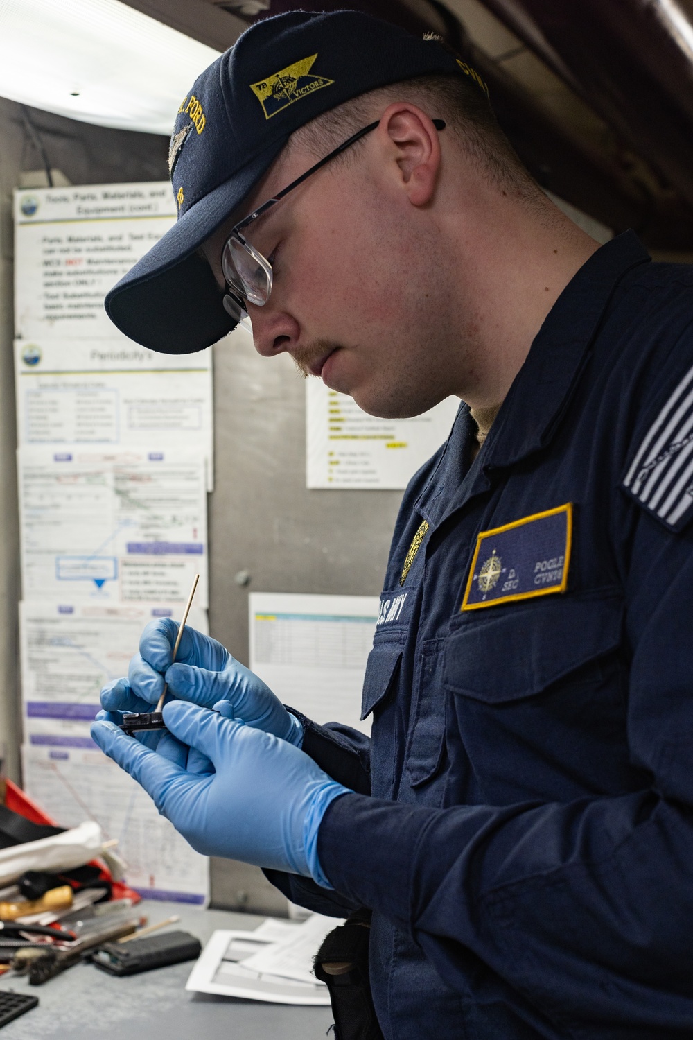 USS Gerald R. Ford (CVN 78) Sailor Performs Armory Maintenance