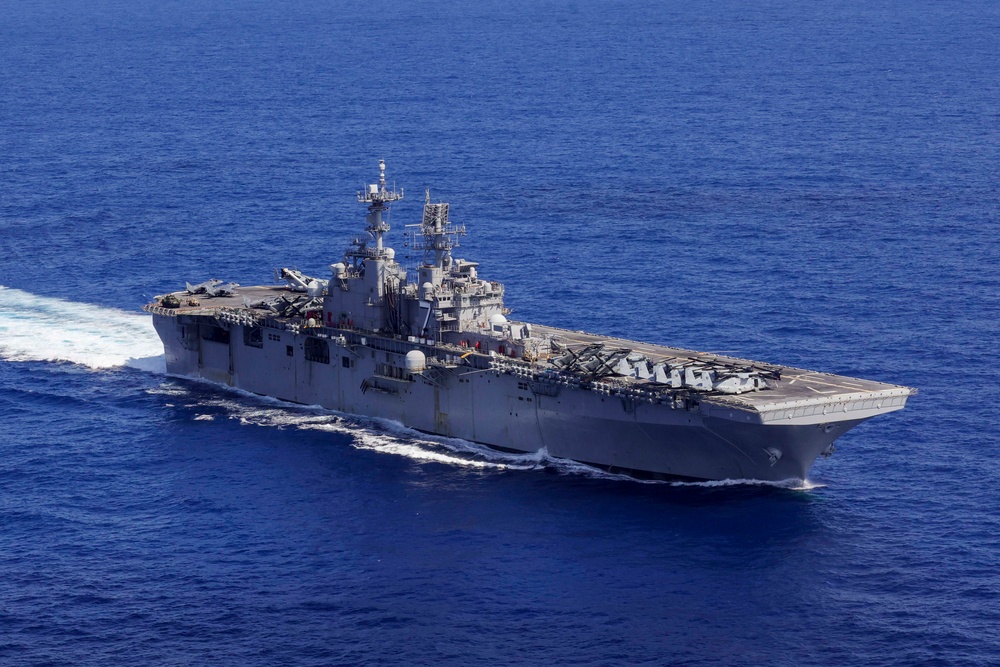 USS Iwo Jima and the USS Fort Lauderdale conduct underway operations