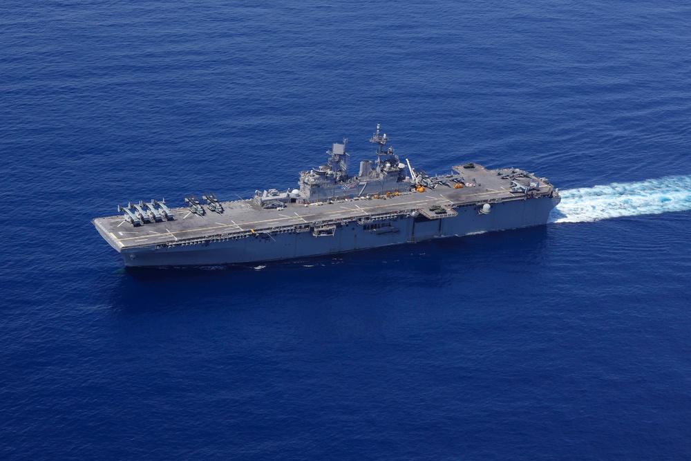 USS Iwo Jima and the USS Fort Lauderdale conduct underway operations
