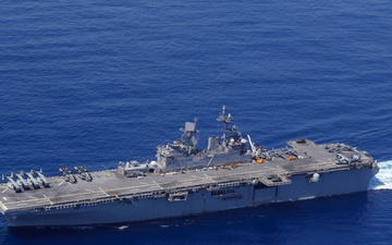 USS Iwo Jima and the USS Fort Lauderdale conduct underway operations