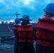 U.S. Navy Sailors maintain the required tension on the phone and distance line during a COMPTUEX replenishment-at-sea