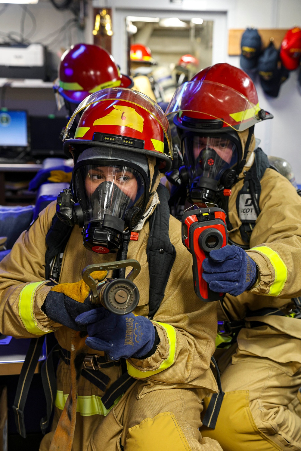 USS Bulkeley Sailors train to fight a fire during a damage control evolution