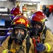 USS Bulkeley Sailors train to fight a fire during a damage control evolution