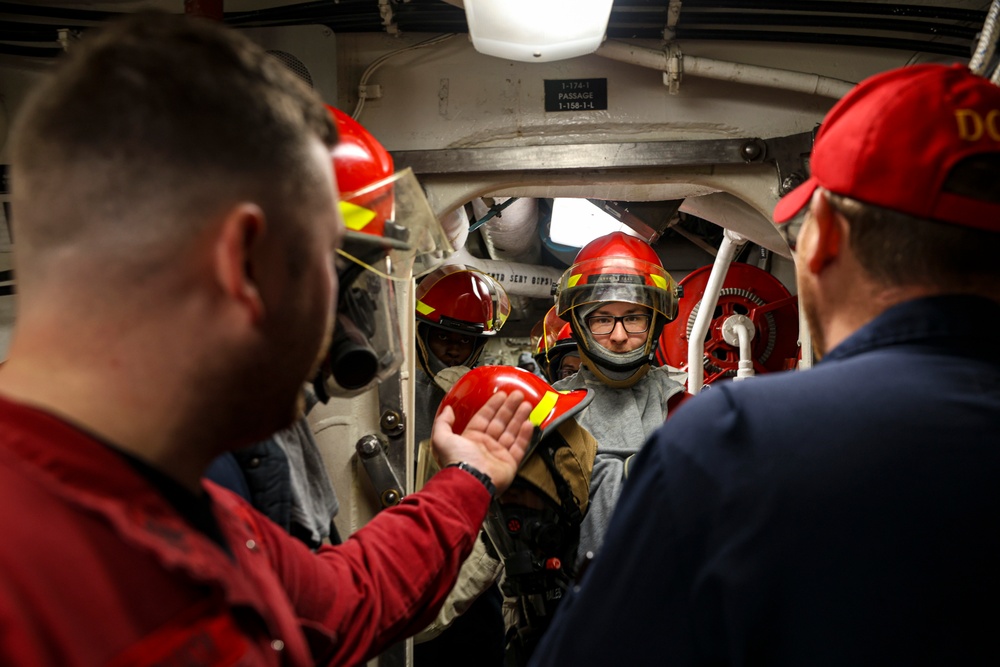 DC1 Cody Dormandy provides firefighting instruction to the fire attack team