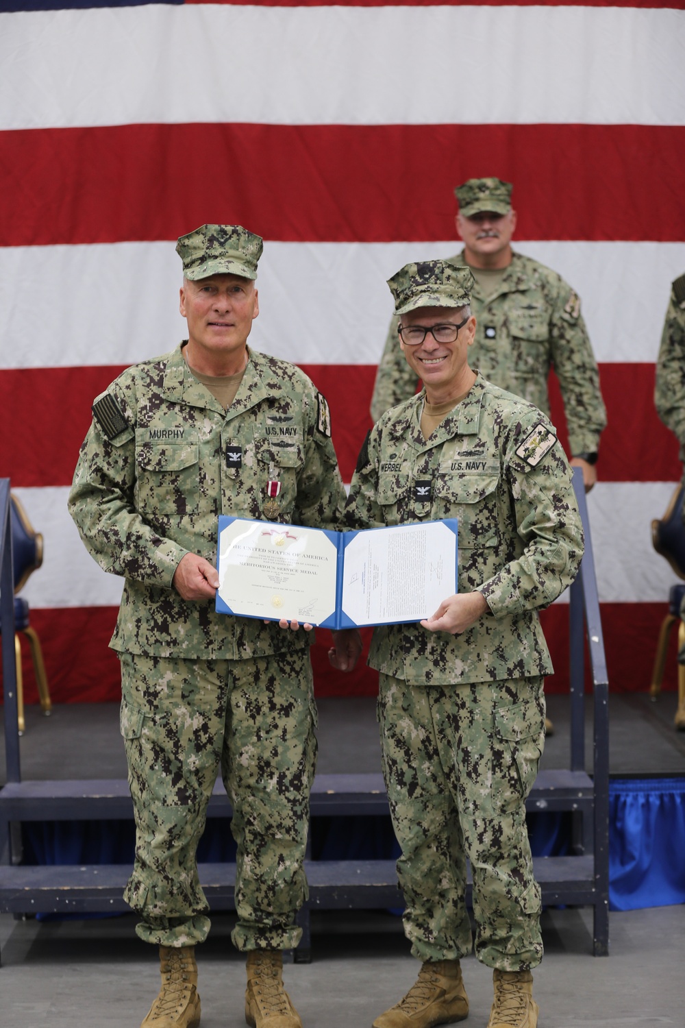 Capt. Aaron Werbel Presents the Meritorious Service Medal to Capt. Thomas Murphy