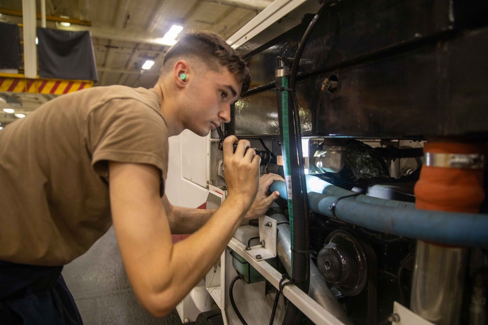 USS Gerald R. Ford (CVN 78) Sailor Conducts AIMD Maintenance