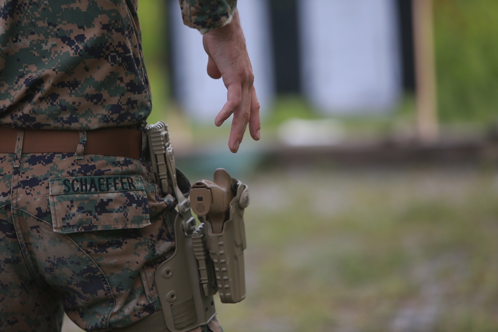 U.S. Marines conduct a pistol qualification course at Atlantic Alliance '25