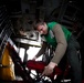 Naval Aircrewman Checks Survival Gear in an MH-60S Sea Hawk