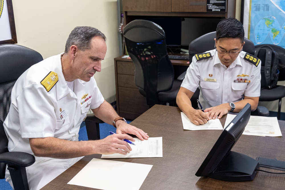 Commander, Submarine Group 7 and Republic of Singapore Commander, 7th Flotilla sign Action Items