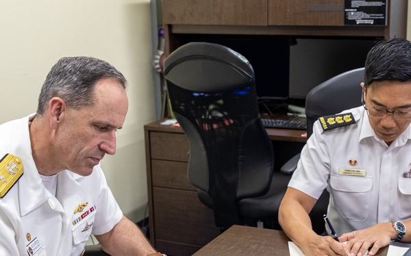 Commander, Submarine Group 7 and Republic of Singapore Commander, 7th Flotilla sign Action Items