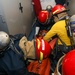 Sailors aboard the USS John Finn conduct a medical training team drill in the Philippine Sea