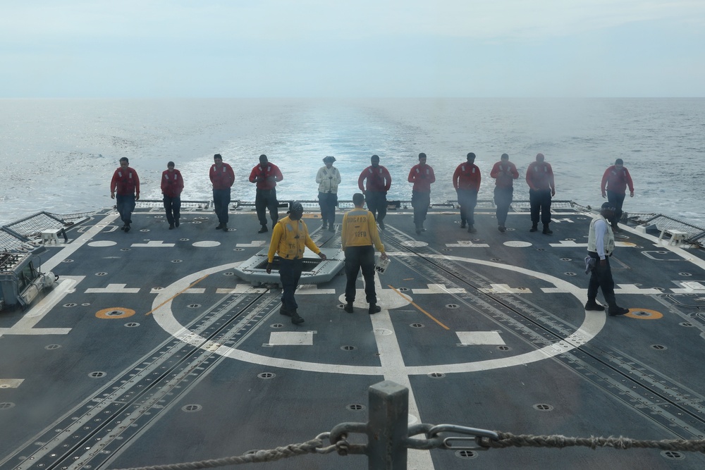 Sailors aboard the USS John Finn conduct flight quarters in the Surigao Strait