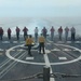 Sailors aboard the USS John Finn conduct flight quarters in the Surigao Strait