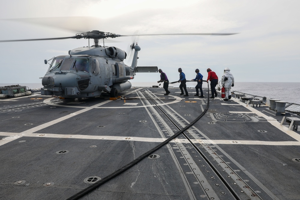 Sailors aboard the USS John Finn conduct flight quarters in the Surigao Strait