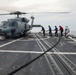 Sailors aboard the USS John Finn conduct flight quarters in the Surigao Strait