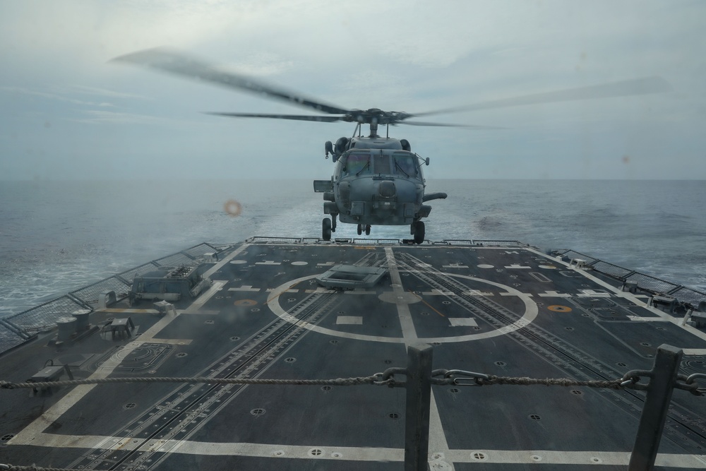 Sailors aboard the USS John Finn conduct flight quarters in the Surigao Strait