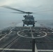 Sailors aboard the USS John Finn conduct flight quarters in the Surigao Strait