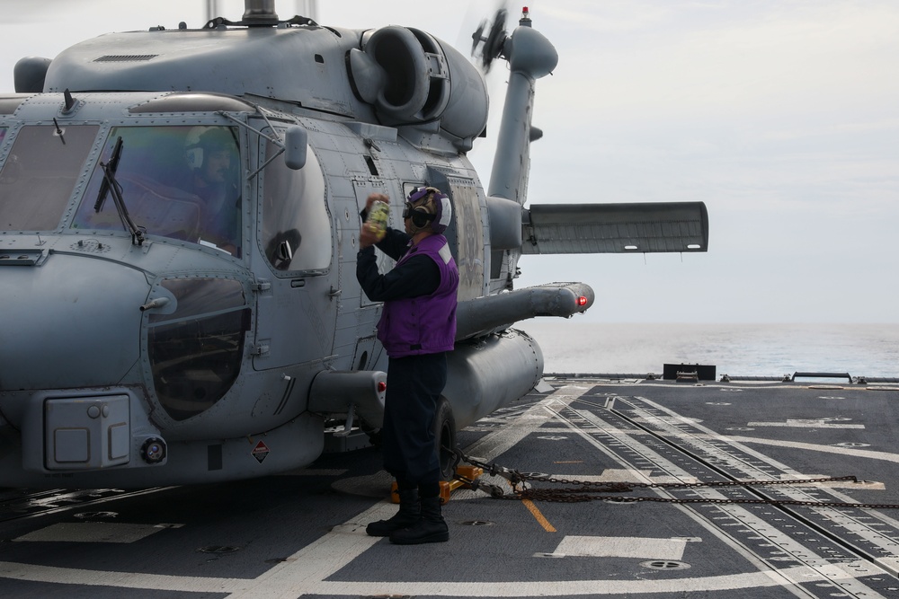 Sailors aboard the USS John Finn conduct flight quarters in the Surigao Strait