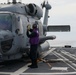 Sailors aboard the USS John Finn conduct flight quarters in the Surigao Strait