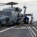 Sailors aboard the USS John Finn conduct flight quarters in the Philippine Sea