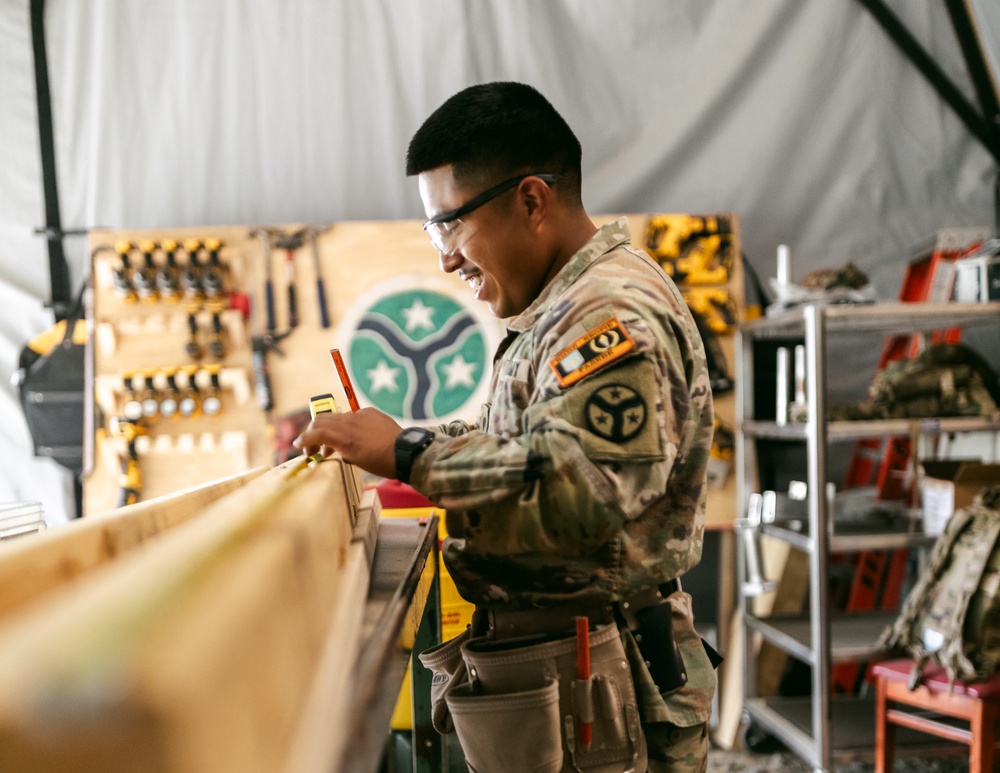 Spc. Angel Constructs Mock Tank for UAV Training