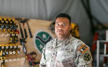Spc. Tucker Builds Weapons Rack in Support of JMTG-U