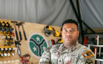 Spc. Tucker Builds Weapons Rack in Support of JMTG-U