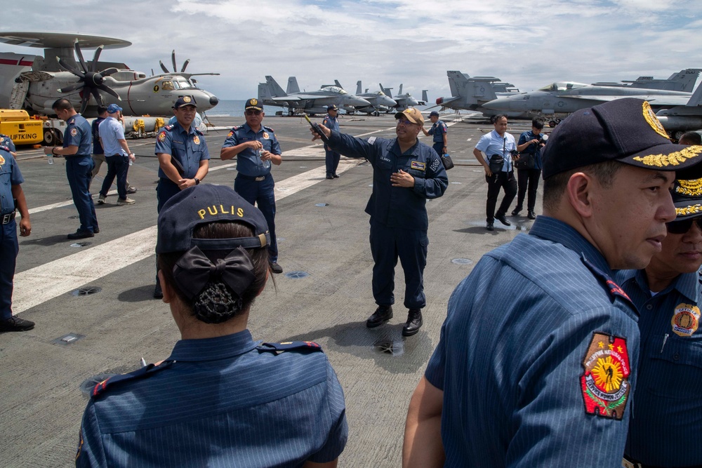 George Washington Hosts Tour for Philippine Police, NCIS Agents