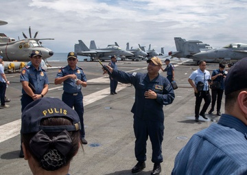 George Washington Hosts Tour for Philippine Police, NCIS Agents