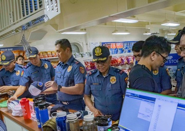George Washington Hosts Tour for Philippine Police, NCIS Agents