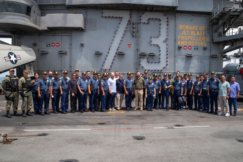 George Washington Hosts Tour for Philippine Police, NCIS Agents