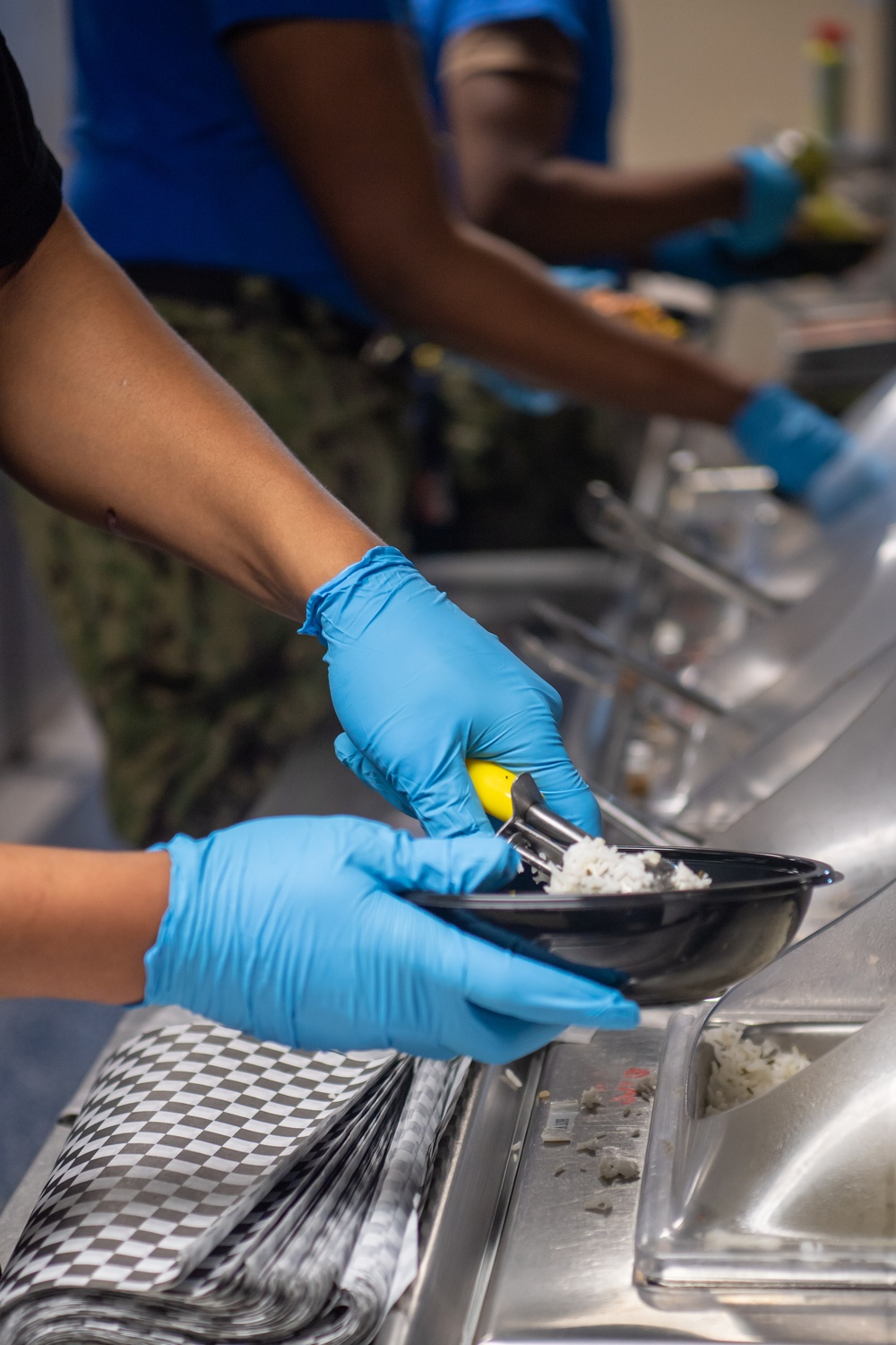 Ronald Reagan Culinary Specialists and Food Service Attendants Serve Lunch