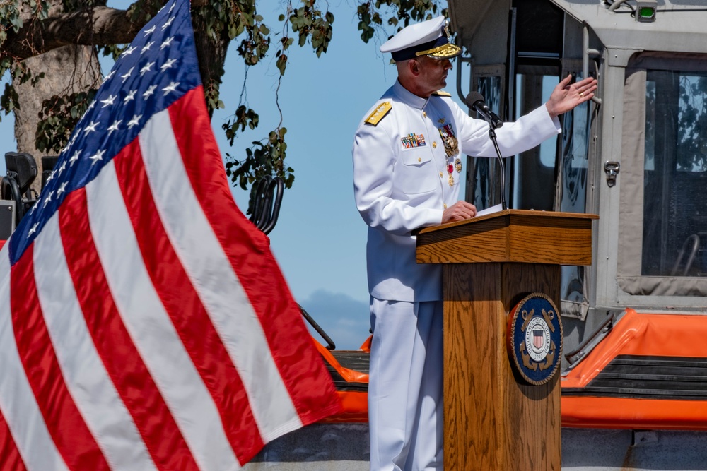 U.S. Coast Guard Rear Adm. Joseph Buzzella gives departing speech