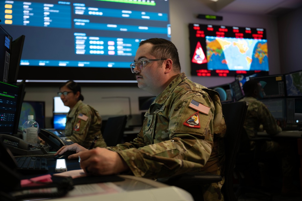 Combined Space Operations Center (CSpOC) staff monitor workstations. Combined Space Operations Center (CSpOC) staff monitor workstations.