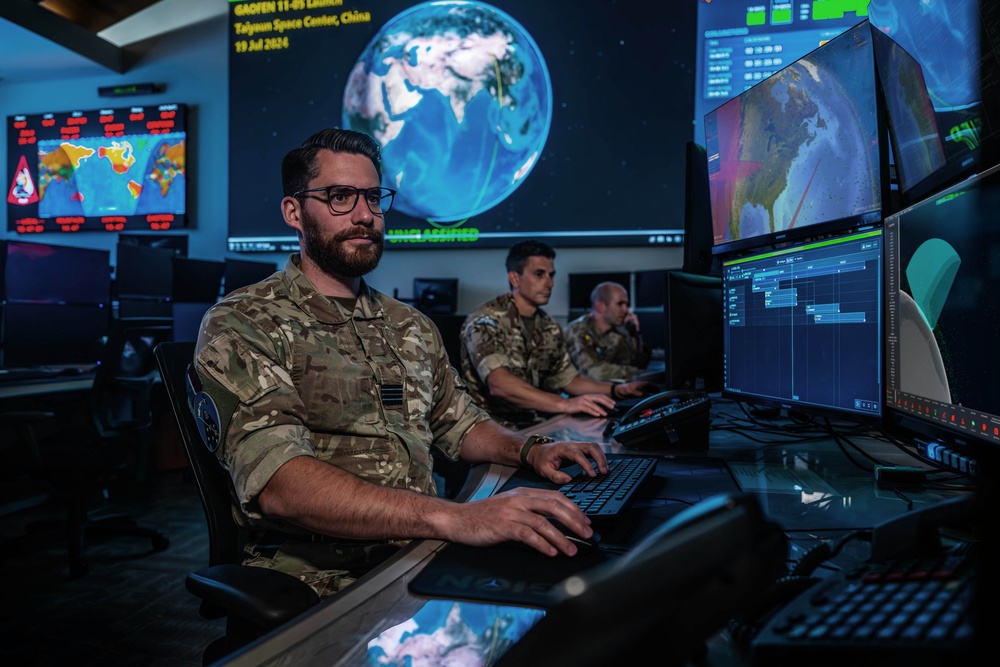 Combined Space Operations Center (CSpOC) staff monitor workstations.