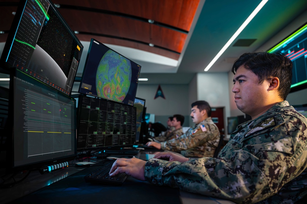Combined Space Operations Center (CSpOC) staff monitor workstations.