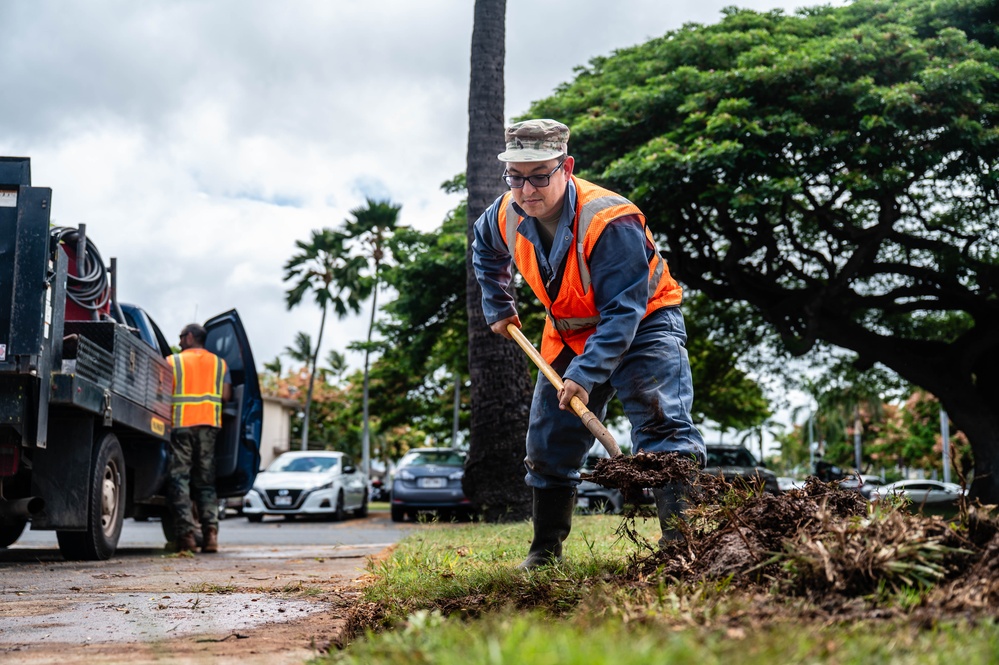 Members of the 647th Civil Engineer Squadron repair a water pipe on JBPHH