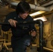 Sailors aboard the USS John Finn conduct an engineering training team drill in the South China Sea