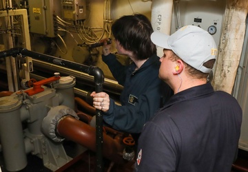 Sailors aboard the USS John Finn conduct an engineering training team drill in the South China Sea