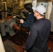Sailors aboard the USS John Finn conduct an engineering training team drill in the South China Sea