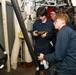 Sailors aboard the USS John Finn conduct an engineering training team drill in the South China Sea